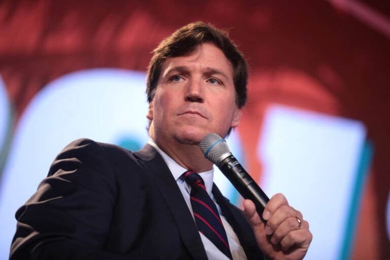 Tucker Carlson, 2018 (CC BY SA 2.0, photo by Gage Skidmore no PD photo exists since Carlson has never held federal office)